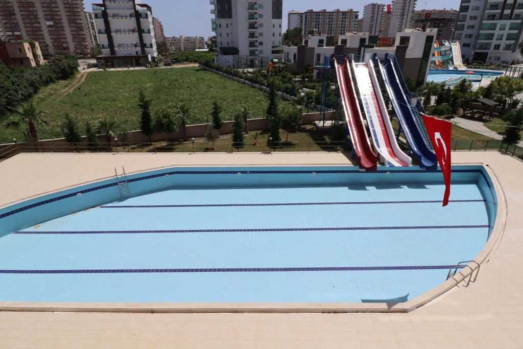 ERDEMLİ TÖMÜK CLASS SİTESİNDE EŞYALI KELEPİR SATILIK 1+1 DAİRE