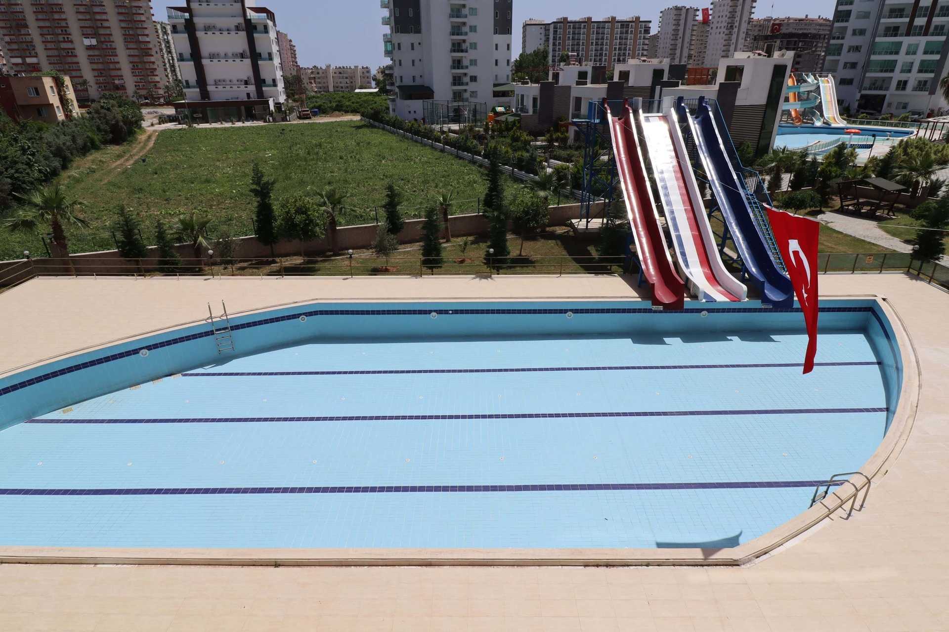ERDEMLİ TÖMÜK CLASS SİTESİNDE EŞYALI KELEPİR SATILIK 1+1 DAİRE