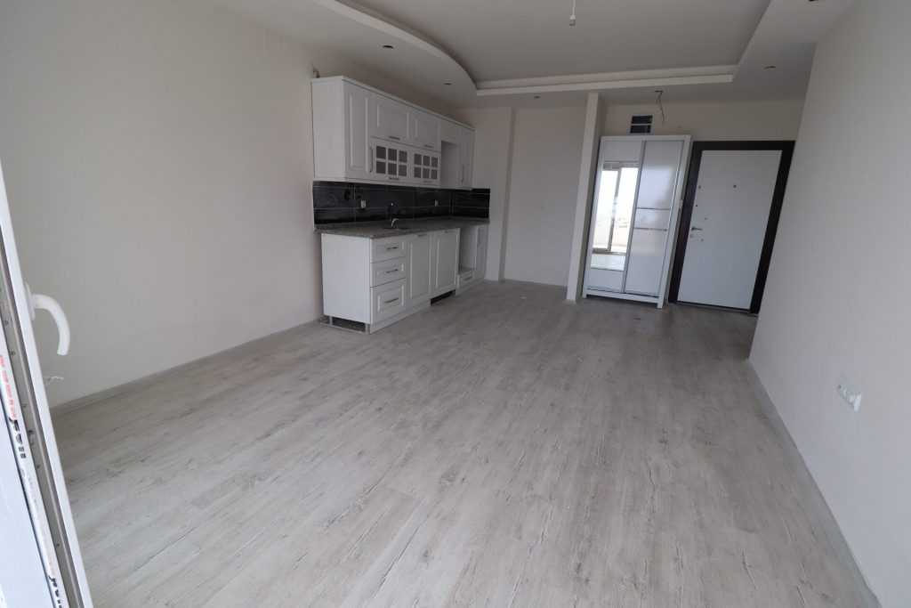 ERDEMLİ ARPAÇBAHŞİŞ DENİZ MANZARALI KUZEY GÜNEY CEPHELİ SATILIK 1+1 SIFIR DAİRE