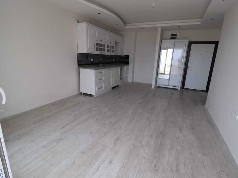 ERDEMLİ ARPAÇBAHŞİŞ DENİZ MANZARALI KUZEY GÜNEY CEPHELİ SATILIK 1+1 SIFIR DAİRE