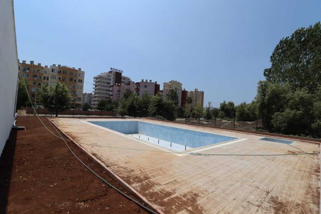 ERDEMLİ ARPAÇBAHŞİŞ DENİZ MANZARALI KUZEY GÜNEY CEPHELİ SATILIK 1+1 SIFIR DAİRE